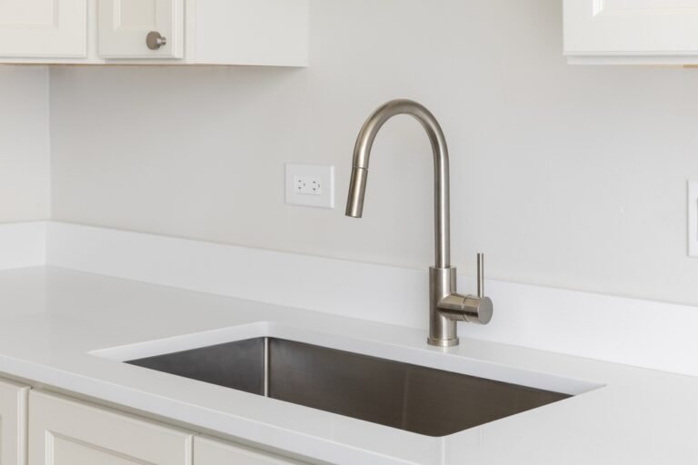 A,Kitchen,Sink,Detail,With,A,Polished,Chrome,Faucet,,White